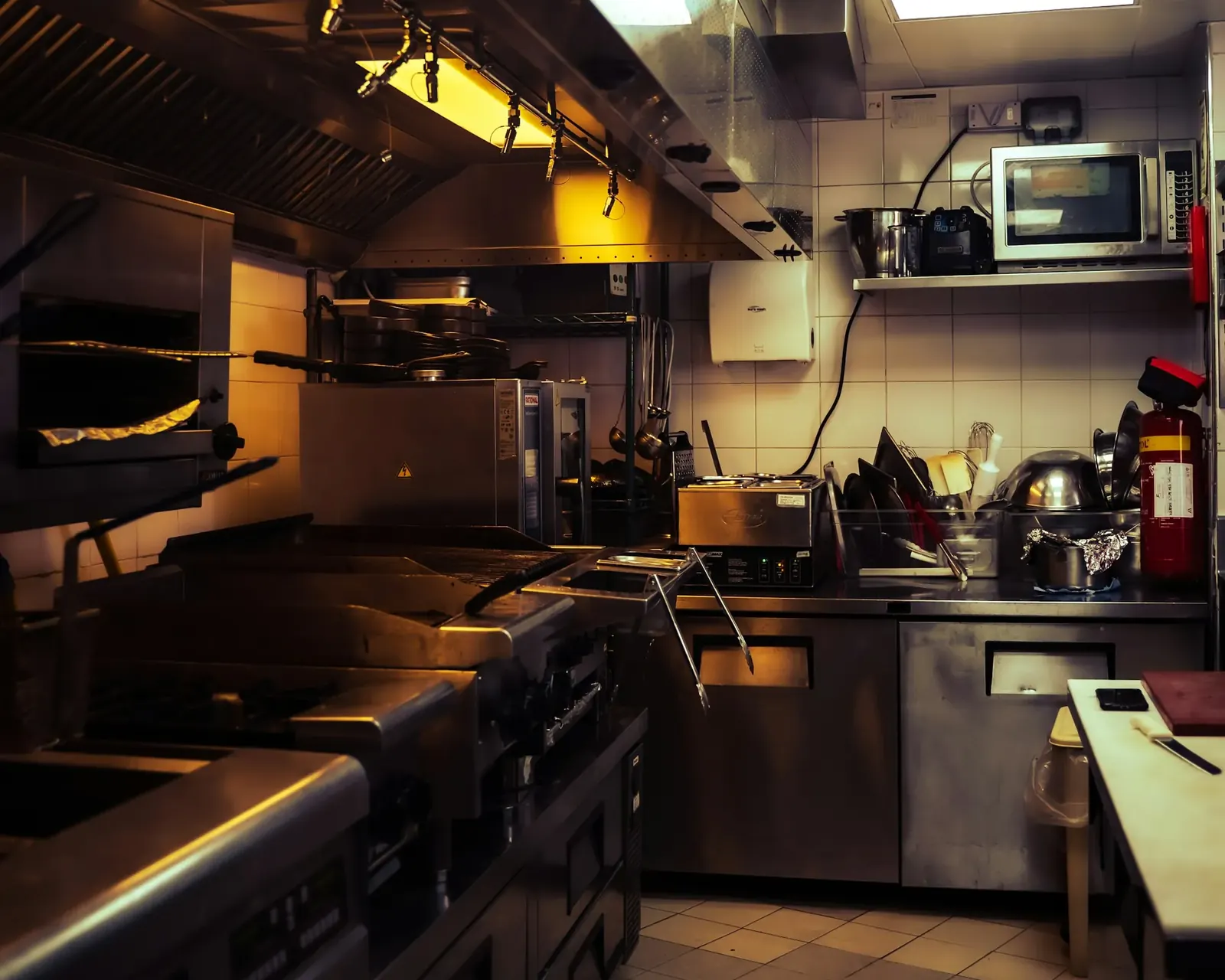 Stainless steel commercial restaurant kitchen with prep stations